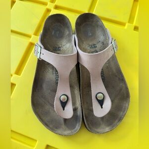 Birkenstock sandals. 
Pale pink and color with gold buckles